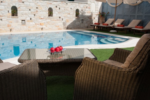 Comfortable armchairs by the central pool