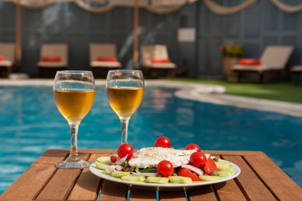 Enjoy a chilled glass of sparkling wine by the pool