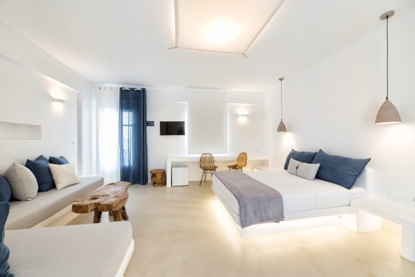 Modern interior design of our Deluxe Suite with Sea View and Outdoor Jacuzzi
